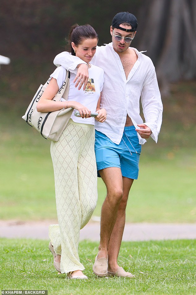 The 19-year-old and Genaro couldn't keep their hands off each other as they went swimming at a Sydney beach.