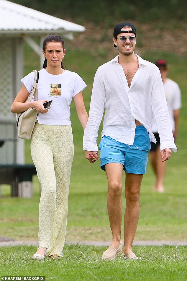 Genaro, for his part, also looked casual in a white long-sleeved linen shirt that he paired with a pair of light blue shorts.