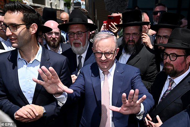 Albo, above, visits the synagogue four days after the event