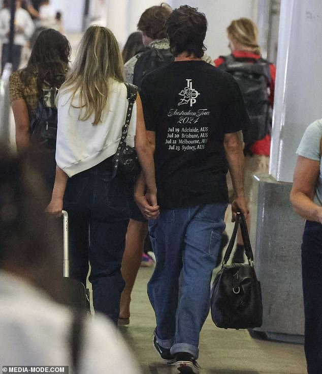 Tim and Lizzie, 15 years his junior and producer of Nova's Fitzy & Wippa, hugged each other as they walked through the terminal.