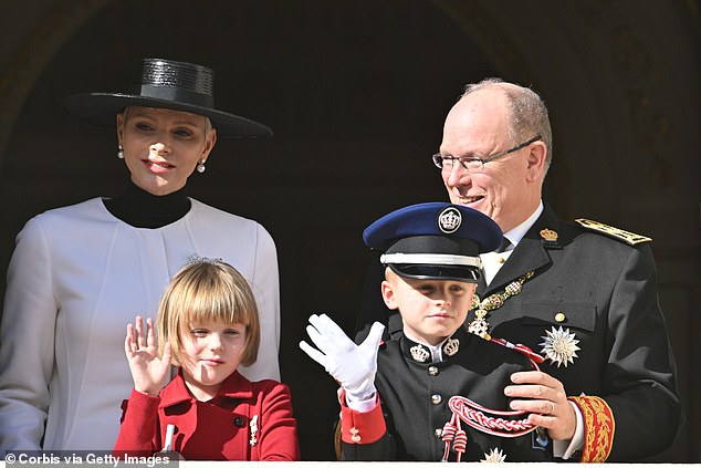 The family of four waves from the palace balcony on Monaco's National Day, November 19, 2022