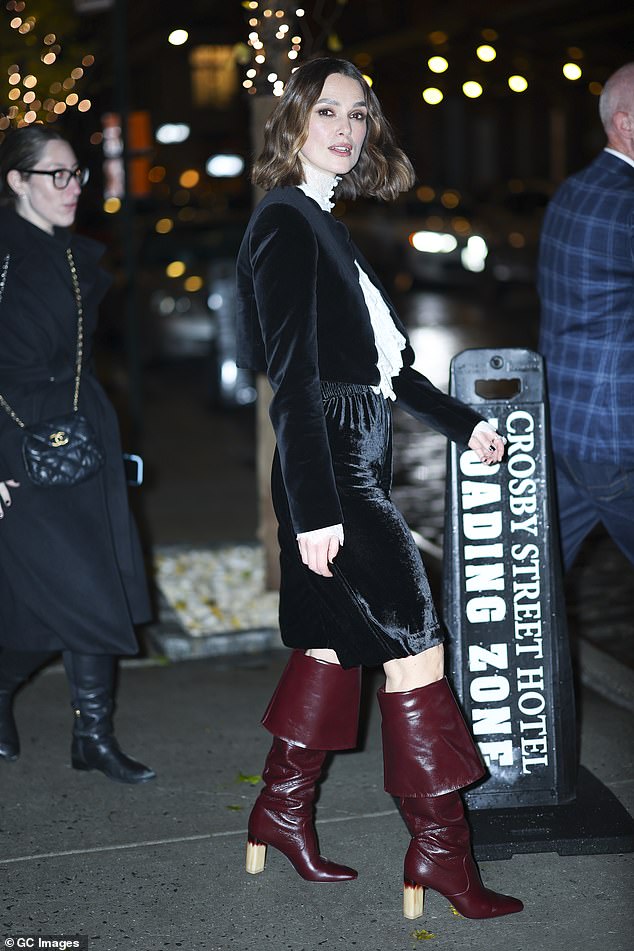 The actress, 39, wore a vintage-style navy blue jacket along with a pair of matching knee-length shorts which she paired with burgundy boots.