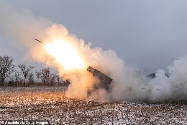 Ukrainian soldiers fire BM-21 artillery at their artillery fighting position in the direction of Kurakhove, Donetsk province