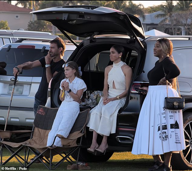 Determined Harry was supported by Meghan, 43, who sat in a car boot in a glamorous white dress and watched the game with tennis legend Serena Williams from the sidelines.