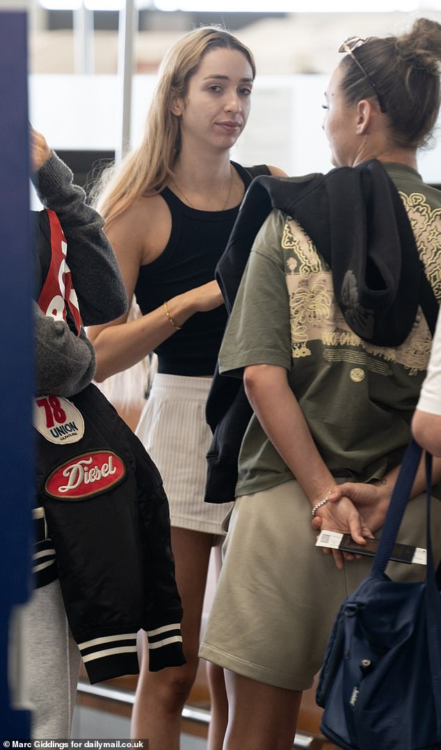 GK was seen at the flight check-in counter with her footballer girlfriend Ella Rutherford, who was wearing a baggy t-shirt and basketball shorts.