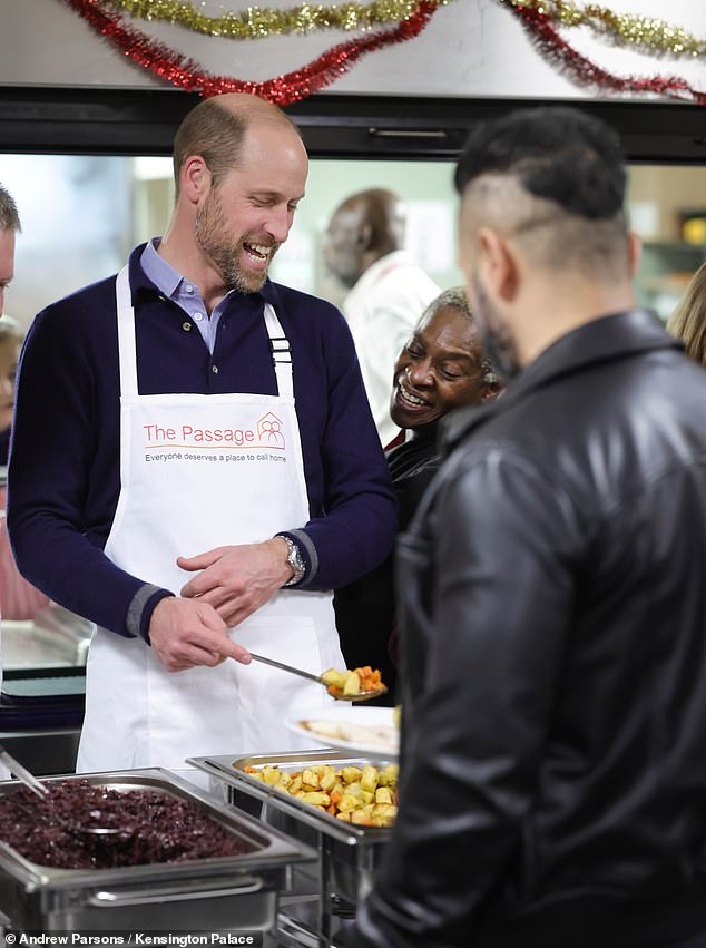 Vegetables? The Prince of Wales chats to the people he serves during his visit to the charity