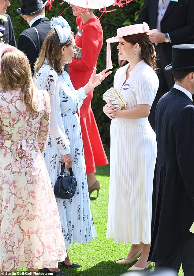 Princess Eugenie was also seen chatting with Carole Middleton before the races began (pictured).