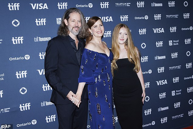 Amy's confession about being wilder than people might expect comes after she opened up about her own experience becoming a mother in 2010 (pictured with husband Darren Le Gallo and daughter Aviana, September 7 2024).