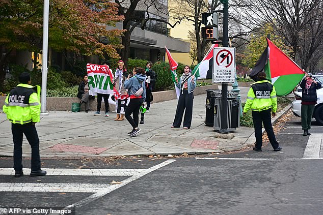 Protesters gathered outside the Brookings Institution as President Biden spoke.