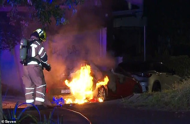 A car was set on fire and vile anti-Israel graffiti was painted on a wall in an anti-Semitic attack in Woollahra, Sydney.