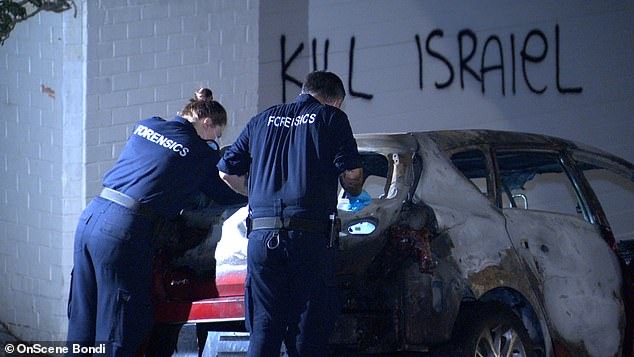 Minns claimed the anti-Semitic attack would receive a full police response (pictured, forensic officers examining the scene)