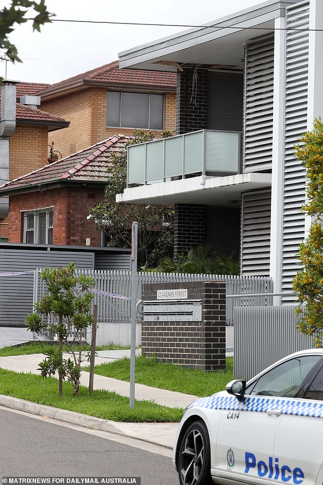 A crime scene has been established in the couple's unit block in Belmore (pictured)