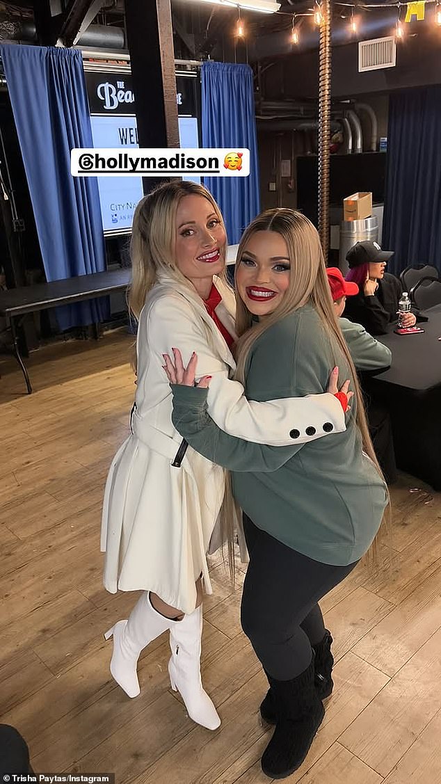 Backstage, Trisha, a former escort/stripper, was visited by The Girls Next Door alum Holly Madison (left).