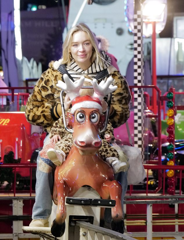 Roxy and her mini-me daughter spun around on the merry-go-round, while Jack watched and took photos.