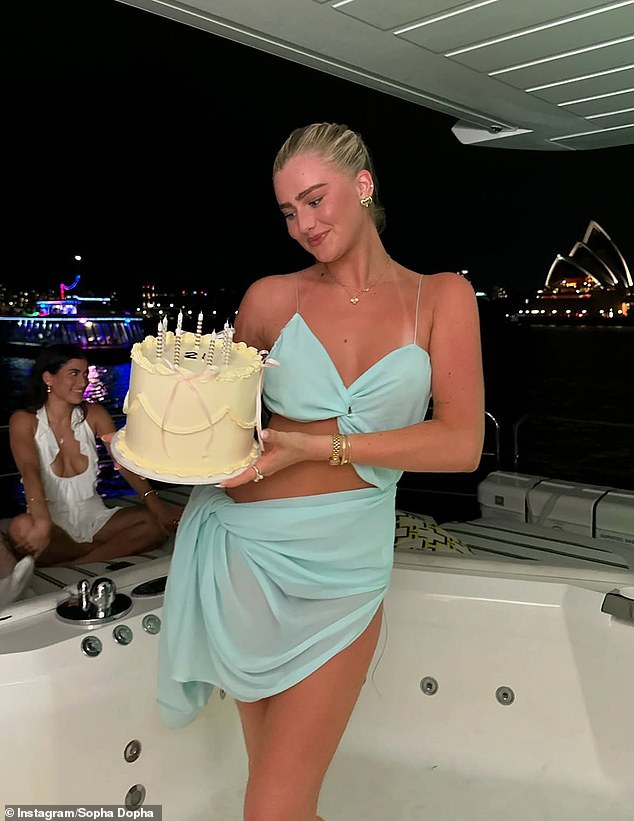 The birthday girl flaunted her incredible figure in a sheer blue dress that looked like a bikini top and a sarong as she jumped into the empty hot tub and started twerking.