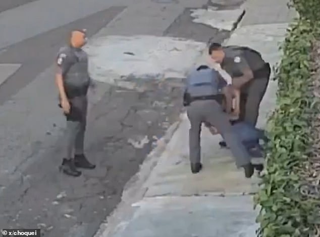 Footage shows police arresting the woman moments after one of them punched her in the face. All three officers have been removed from patrol duties.