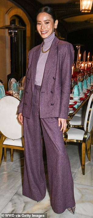 The Grown Ups star oozes sophistication in a dark purple tweed suit, complete with tailored wide-leg pants.