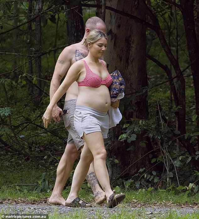 The couple was all smiles as they jogged through the woods.