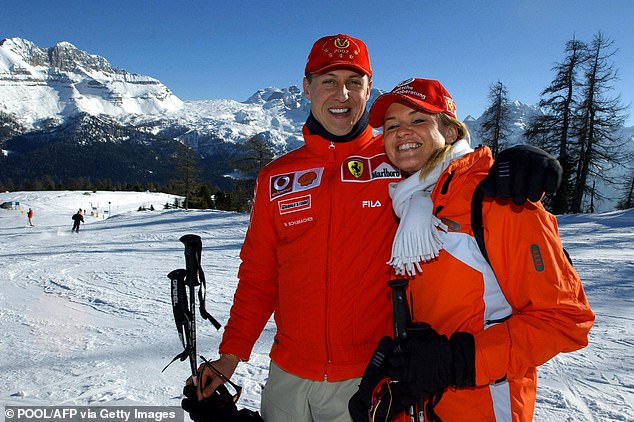 Formula One world champion Ferrari driver Michael Schumacher (left) poses in Madonna di Campiglio with his wife Corinna on January 16, 2003.