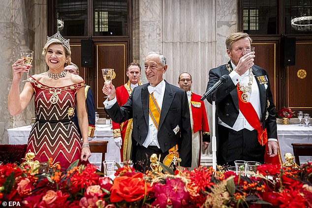 Queen Máxima of the Netherlands raises her glass alongside the President of Portugal, Marcelo Rebelo de Sousa, and King Willem-Alexander.