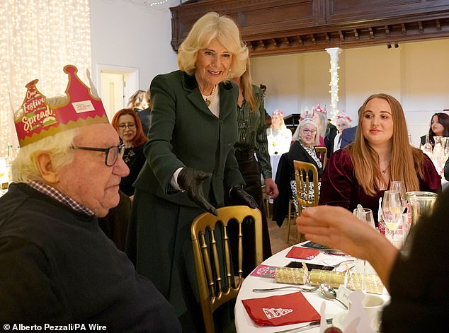 Queen Camilla, Patron of the Royal Voluntary Service, joined lunch club diners, volunteers and staff for a Christmas lunch today 