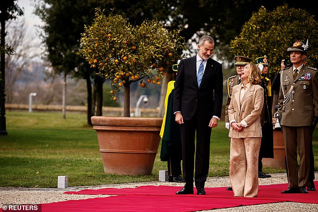 Felipe, 56, is pictured with Meloni in the gardens of the Doria Pamphili villa in Rome.