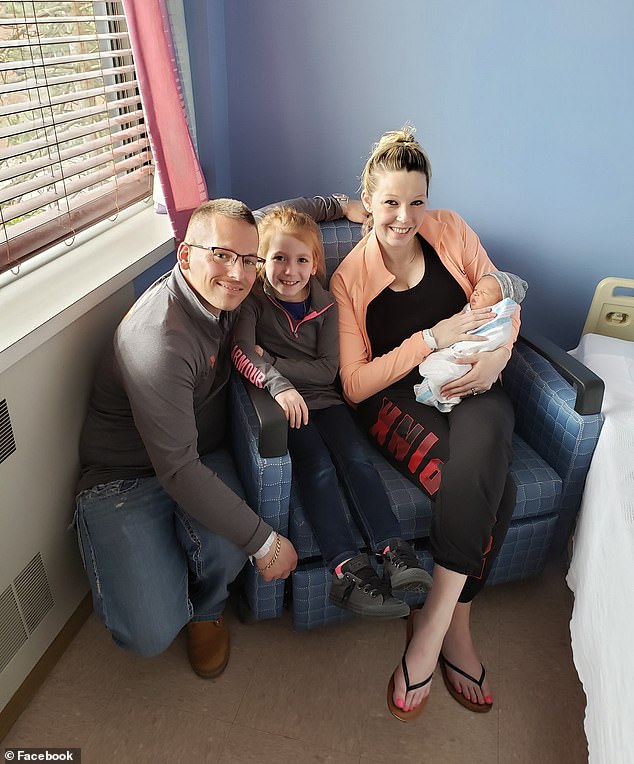 Elizabeth Dominguez (right) was temporarily separated from her newborn son Carter after he ate a poppy seed bagel that caused him to test positive for opioids. She appears in the photo after being reunited with her baby, along with her husband and eldest daughter.