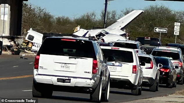 A small plane crashed into three cars at an intersection shutting down a busy Texas parkway Wednesday