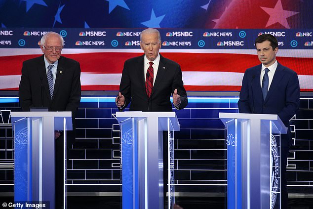 Democratic presidential candidate, former Vice President Joe Biden (C) speaks as former Senator Bernie Sanders (I-VT) (L) and former South Bend, Indiana Mayor Pete Buttigieg listen during the Democratic presidential primary debate in Paris, Las Vegas on February 19. 2020 in Las Vegas