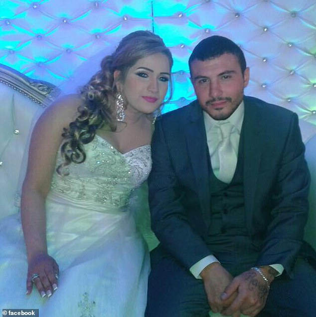 Sitting arm in arm, the couple poses for the camera on their wedding day (pictured)