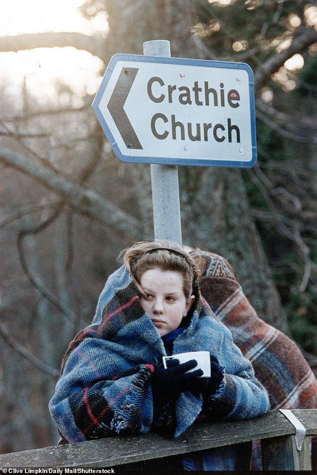 A member of the public waiting outside the church to catch a glimpse of the wedding