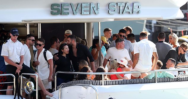 With Australian workplace Christmas parties in full swing, employees are reminded to be careful when making a pass at a colleague (pictured, an office Christmas party on a boat)