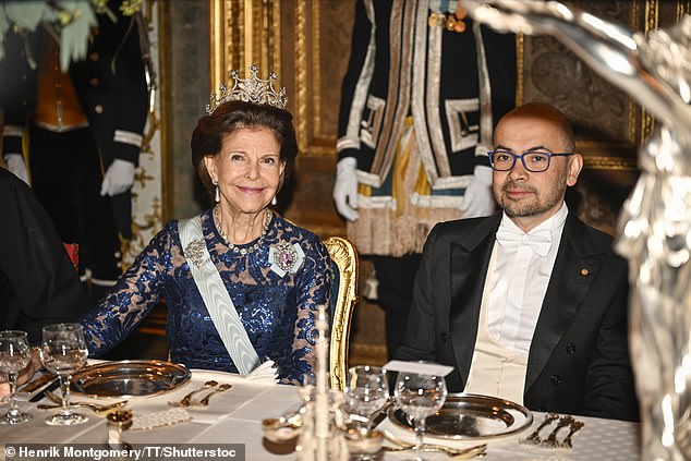 Queen Silvia sat next to chemistry winner Demis Hassabis (photo) during dinner.