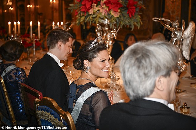 Princess Victoria wore her brown hair, brushed back in an elegant chignon, with a striking diamond-encrusted, two-tiered tiara