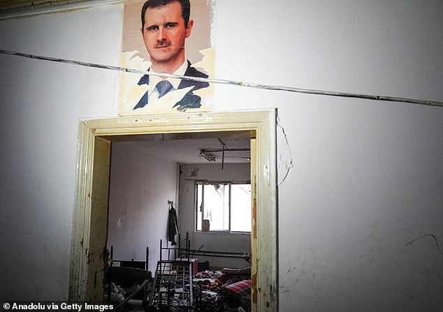 Torn photographs of dictator Bashar al-Assad were seen on the prison door frames.