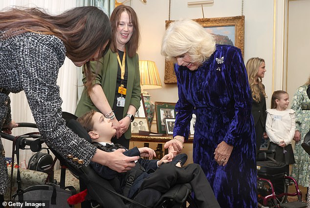 The Queen chatted with children and handed out beautifully wrapped Christmas presents