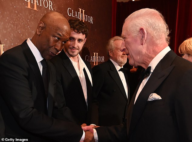 Mescal watches as Denzel Washington meets with King Charles III as they attend the Royal Film Performance and world premiere of 