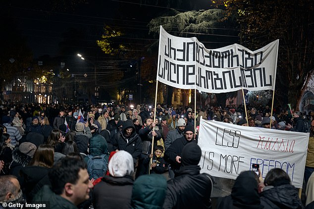 People gathered to protest in front of the Parliament building on December 9, 2024 over the results of last month's parliamentary elections in Tbilisi, Georgia.