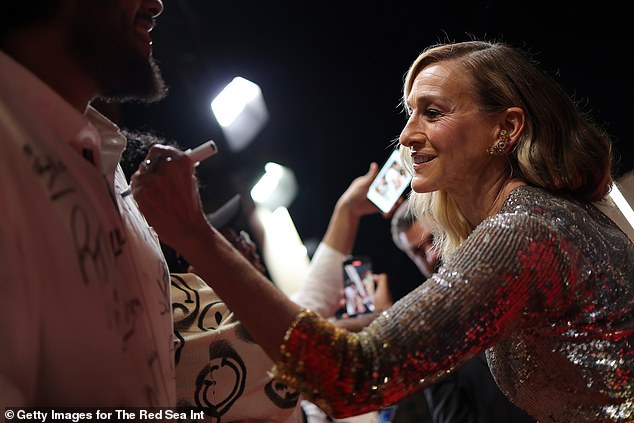 In one snap, the actress excitedly signed someone's shirt, before heading inside the celebrity-filled party.