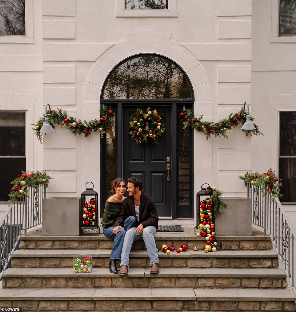 They were seen posing in a stunning two-story white mansion while giving it a Christmas touch before Santa came to town.