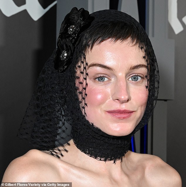 Corrin tucked her raven pixie cut into a fishnet-wrapped hood, and makeup artist Gina Kane highlighted her baby blues with dark brows and rosy cheekbones.