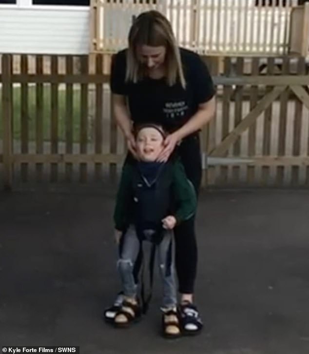 Frankie's favorite machine was called the Upsy and it helps him stand up, hold his head up and walk, assisted by an adult.