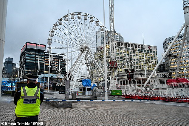 Police at the cordoned off Star Flyer promenade in Centenary Square, Birmingham, on Friday morning.