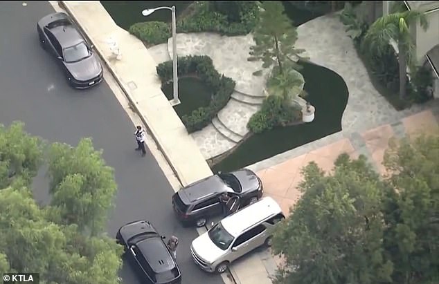 In the hours leading up to her arrest, police were seen searching her Calabasas home