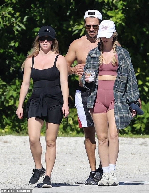 The actress, 27, rocked a stretchy black swimsuit while enjoying a sunny stroll with her shirtless fiancé, Jonathan Davino, 41, and their friends near their $13 million mansion in the Florida Keys .