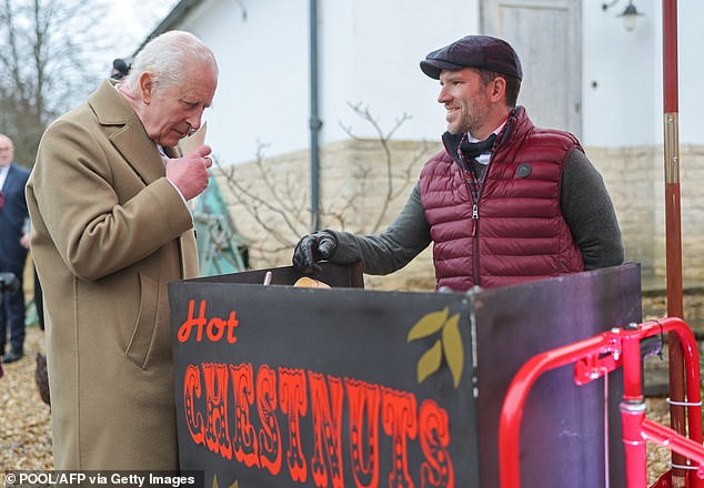 Her Majesty got caught up in the activities on offer at the Tetbury-based event and smelled hot roasted chestnuts.