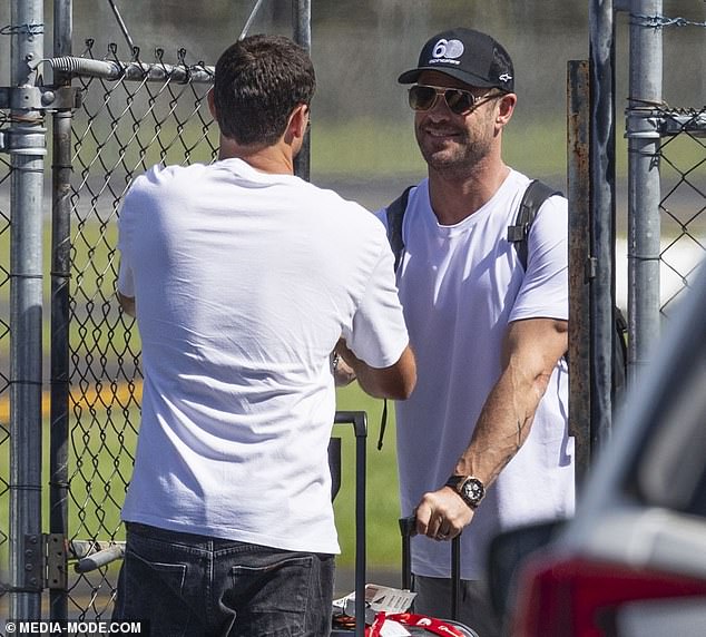 The Hollywood icon looked travel-ready in a white T-shirt and baggy gray pants, which he teamed with a pair of sleek white sneakers.