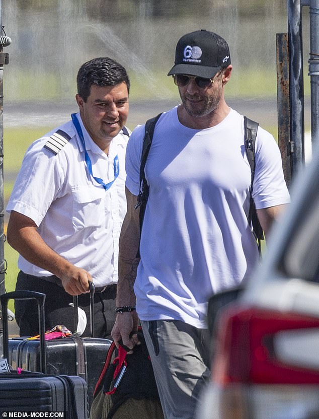 Keeping a low profile, Chris shielded his eyes from the bright sun with a pair of aviator glasses and sported a black baseball cap.