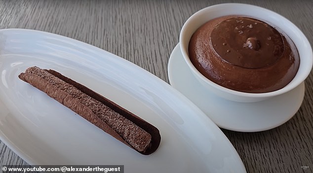 Dessert is hot chocolate soufflé in a bowl and a bar of cold cocoa ice cream. 