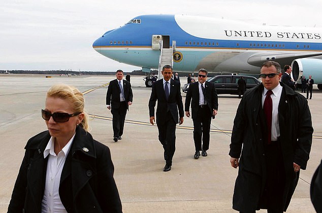 Evy on guard protecting President Obama, 2012